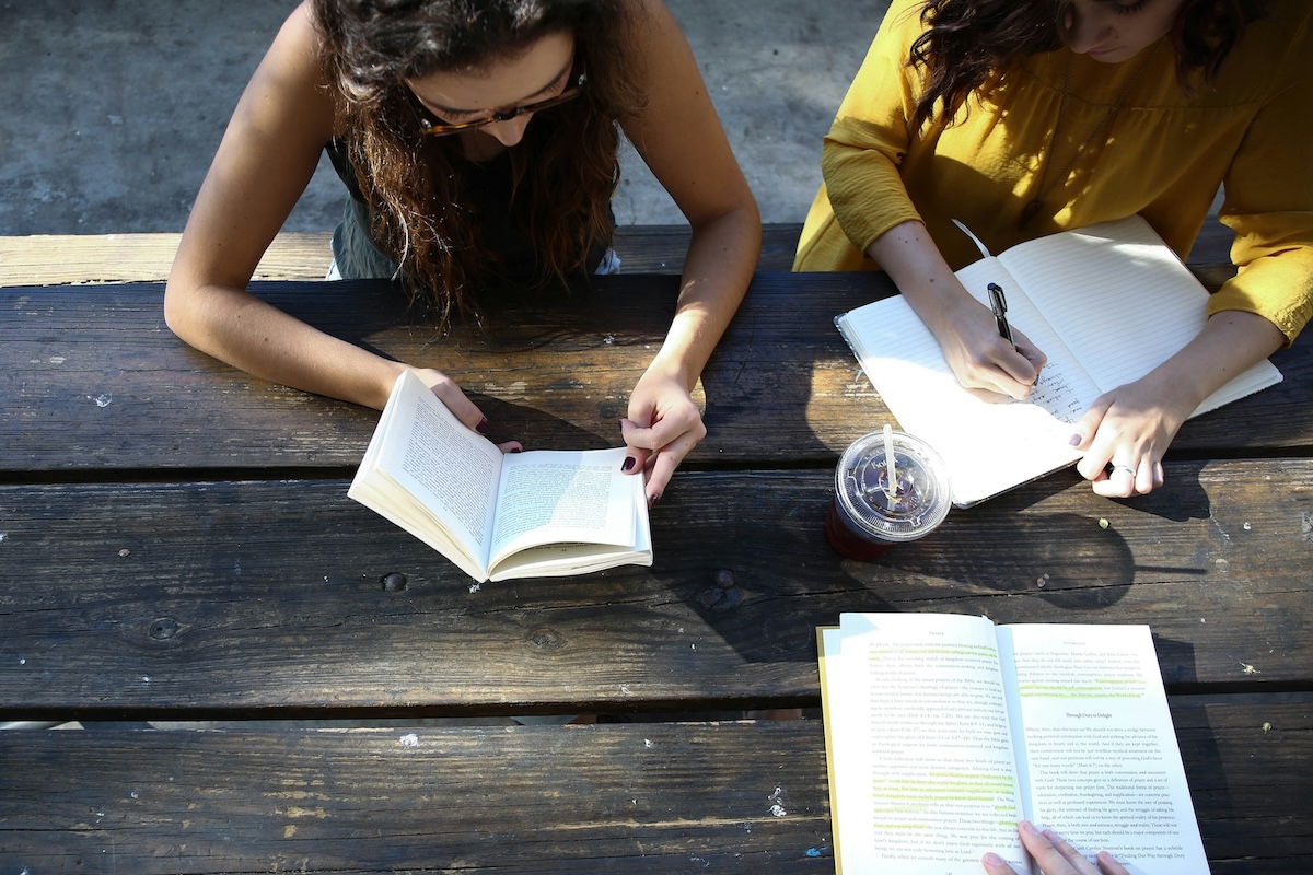 teachers sitting at a picnic table